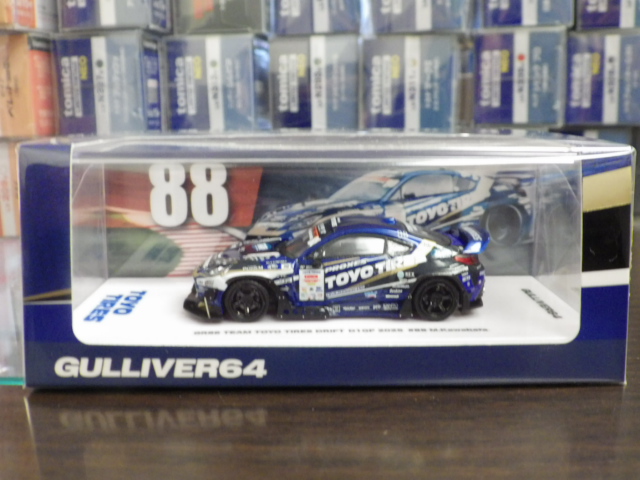 ミニカーショップグローバル - 1/64 GULLIVER64 GR86 チームトーヨー