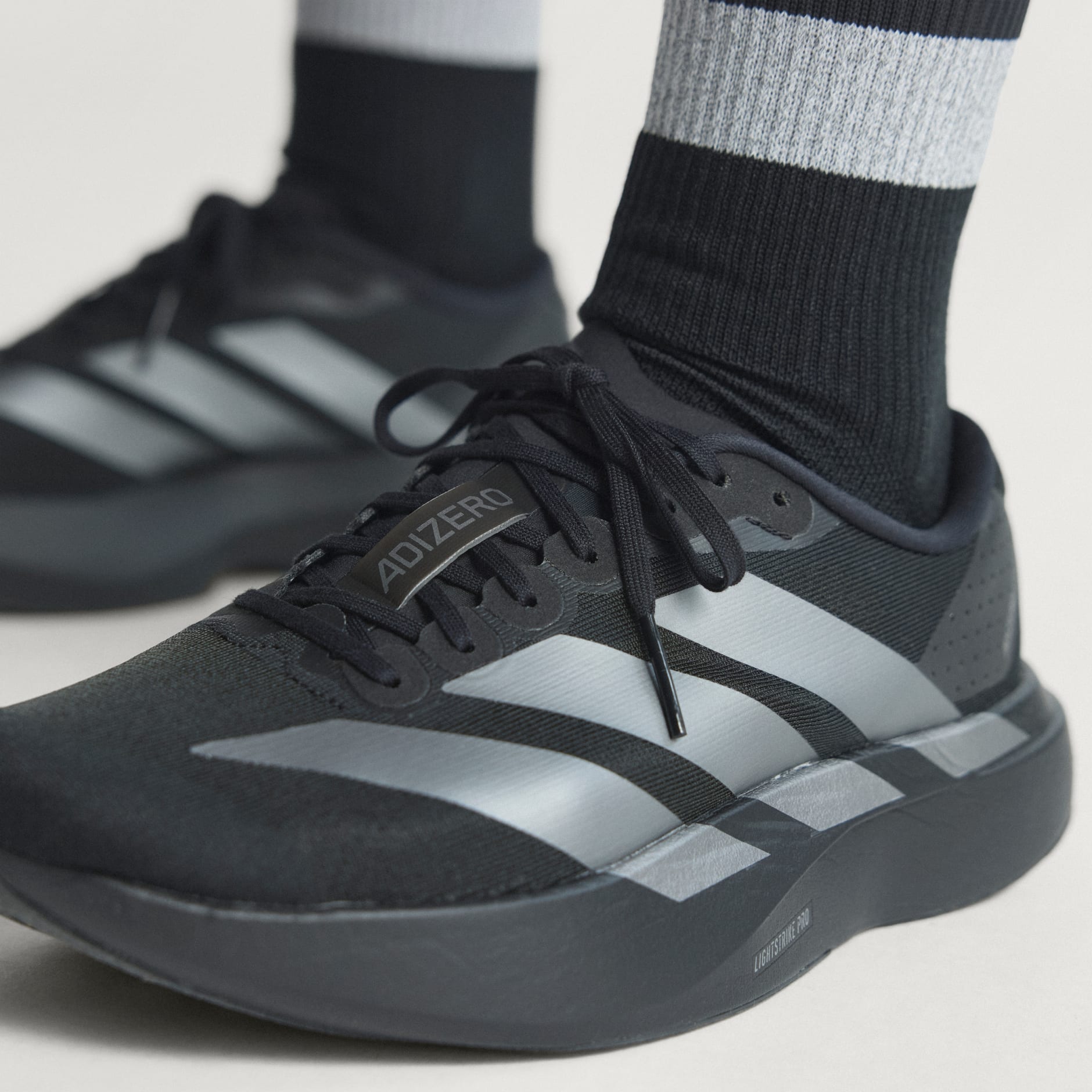 SHOES - Adizero EVO SL Shoes - Black | adidas Oman