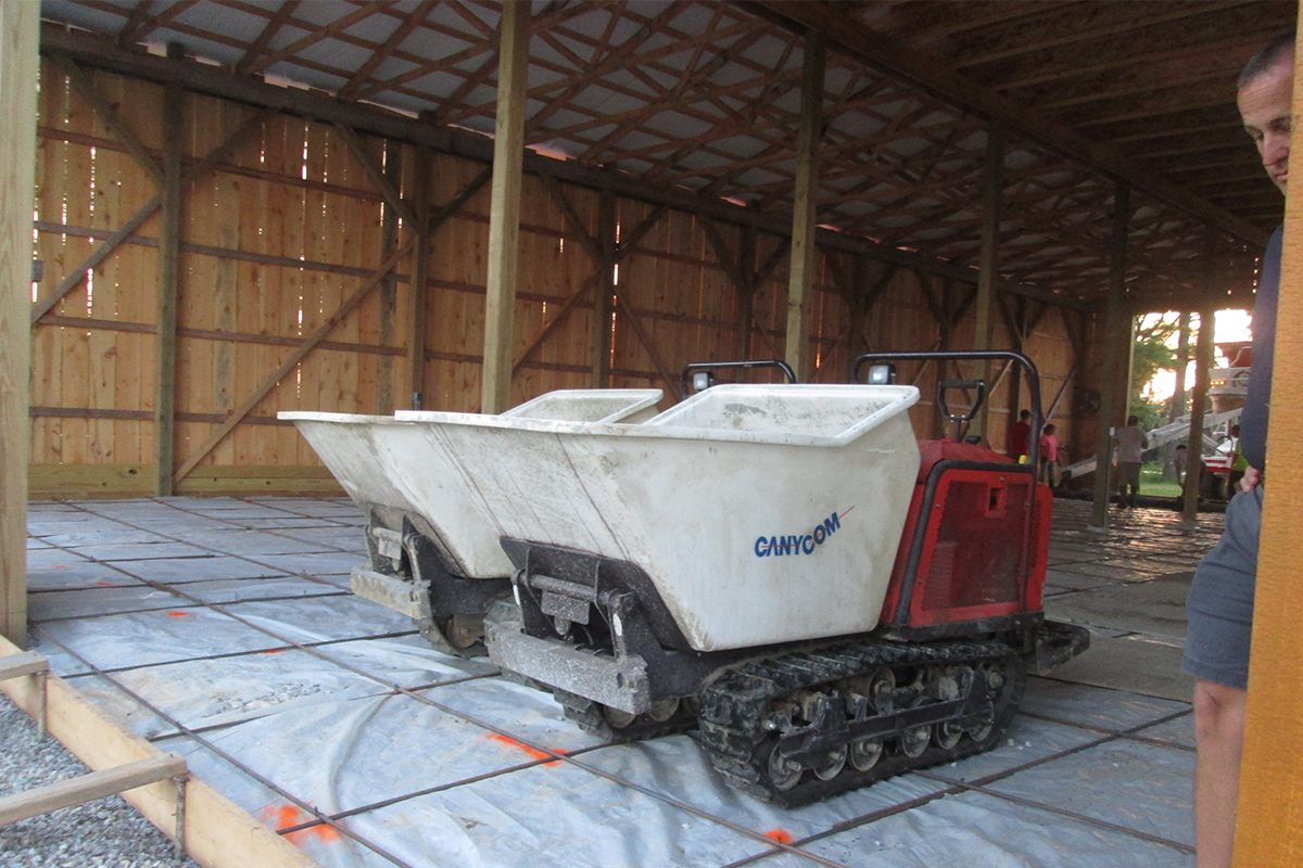 SC75PD Propane Pivot Dump Stand-on Rubber Track Buggy | Canycom USA