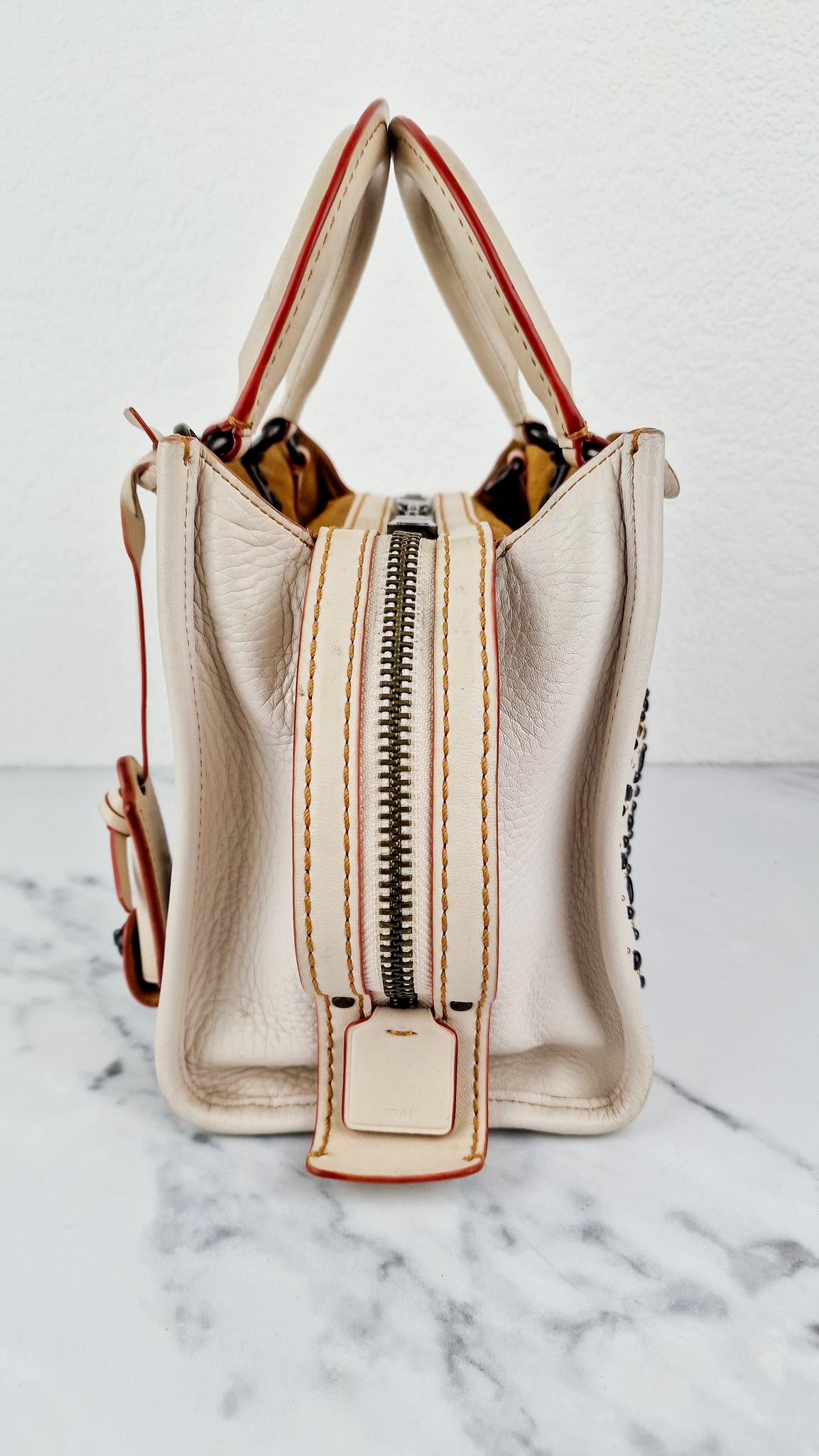 Coach 1941 Rogue 25 in Chalk White With Pyramid Prairie Rivets
