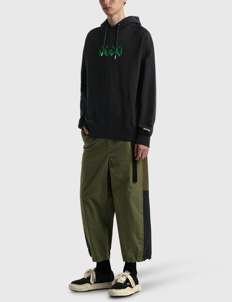 Sacai - KAWS フロック プリント パーカー | HBX
